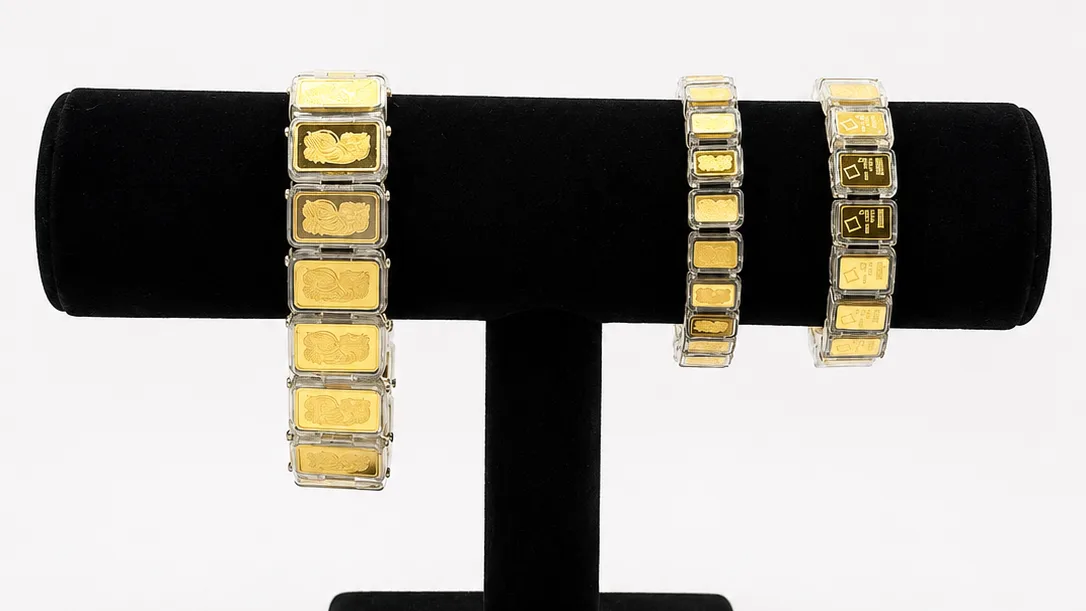 Three bracelets on a velvet stand, each holder sized to a different bar format